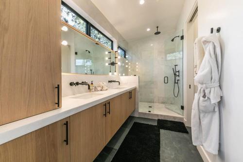 a bathroom with a sink and a shower and a tub at Luxurious 4BR 3 Min to Palisades Tahoe in Olympic Valley