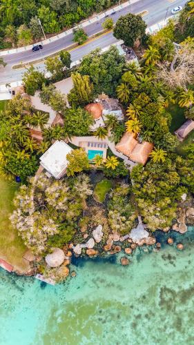 an aerial view of a tropical island in the water at Azulea Bacalar Hotel & Spa - Lagoon Front in Bacalar