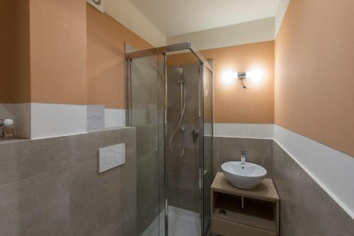 a bathroom with a shower and a sink at Montecatini Terme Art Loft in Montecatini Terme