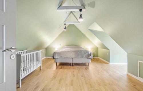 a bedroom with a bed in a attic at Lovely Apartment In Nykøbing Sj in Lumsås