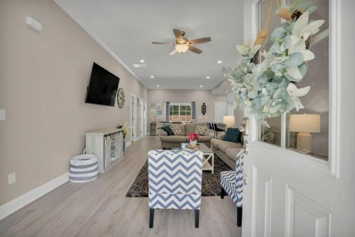 a living room with a couch and a table at Charming Beach House Short Walk To Beach in Myrtle Beach