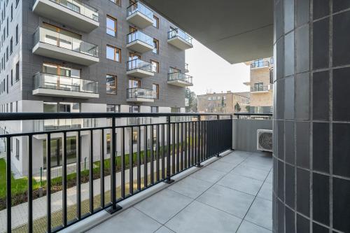 an apartment balcony with a railing and a building at Apartament przy Koscielnej in Poznań