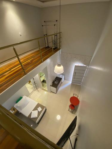 an overhead view of a room with a table and a chair at Pousada Aurora in Alto Paraíso de Goiás