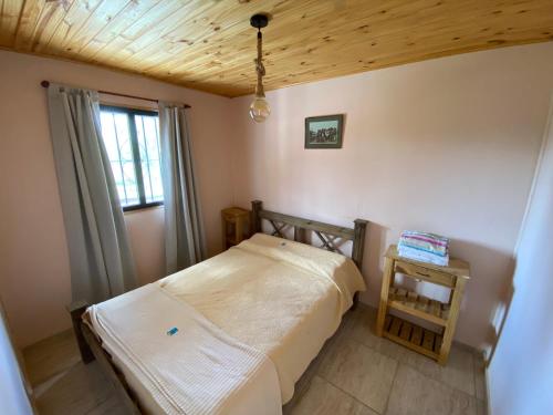 Postel nebo postele na pokoji v ubytování DOÑA ROSA CABAÑAS