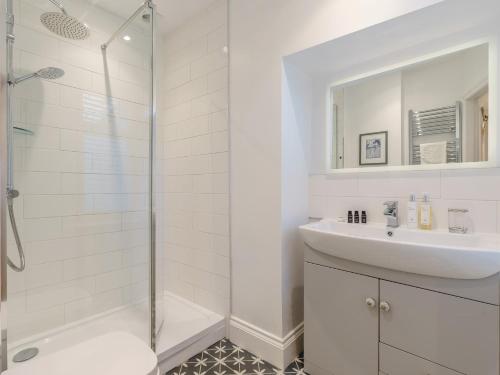 a white bathroom with a sink and a shower at 1 Bed in Richmond 88054 in Richmond