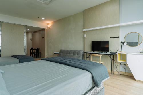 מיטה או מיטות בחדר ב-SUMMER SUITES APARTMENT CASETTA HOMESTAY 2 at Kota Samarahan Kuching