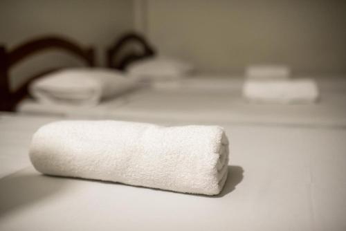 a white towel sitting on top of a counter at HOTEL CENTRAL DE FORTALEZA in Fortaleza