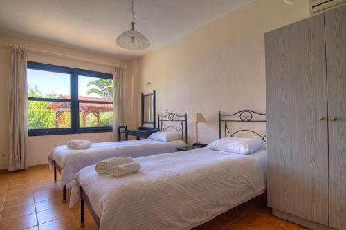 A bed or beds in a room at Sea View Villas