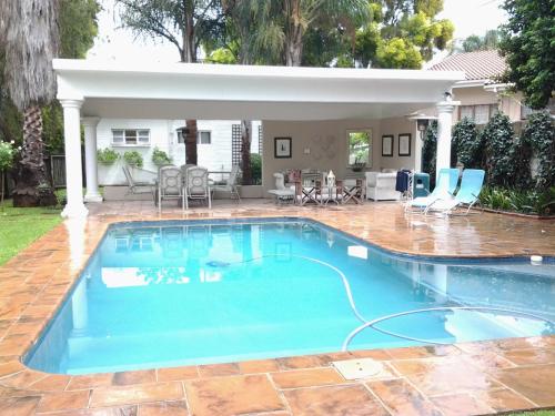 a swimming pool in the backyard of a house at Hunter's Lodge in Ladysmith