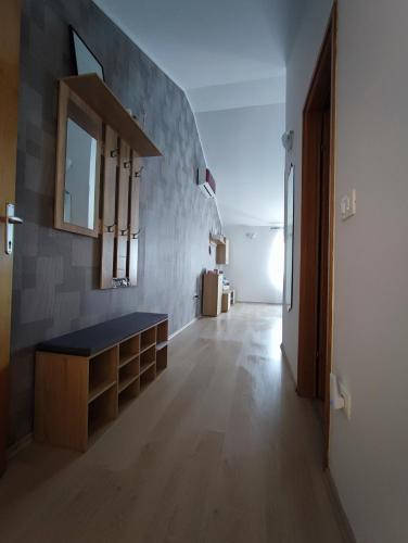 a room with a counter and a mirror on a wall at Apartment Nika in Umag