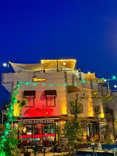 a building with christmas lights in front of it at Rebetika Hotel & bistro in Selcuk