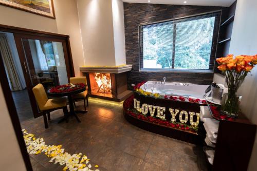 a bathroom with a tub with the words i love you at Sangay Spa Hotel in Baños