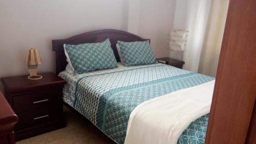 Postel nebo postele na pokoji v ubytování Suites los Abuelos