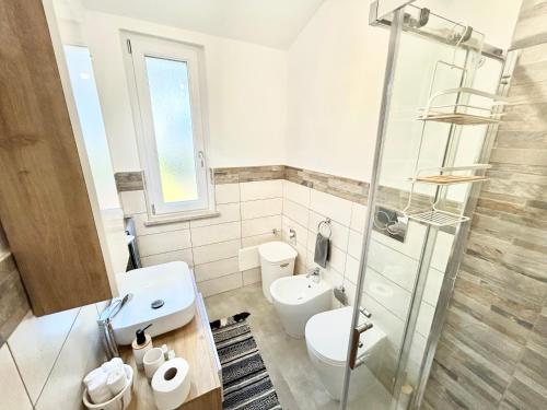 a bathroom with a toilet and a sink and a shower at Dolce Vita Sperlonga in Sperlonga