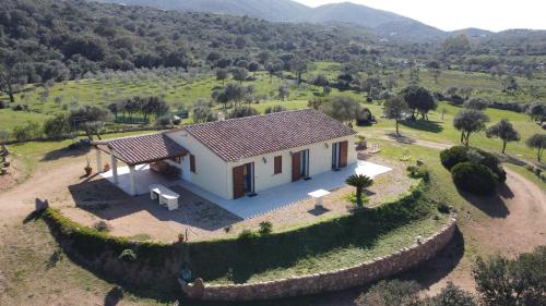 an aerial view of a small house in a field at Molti Mari B&B Resort in Olbia