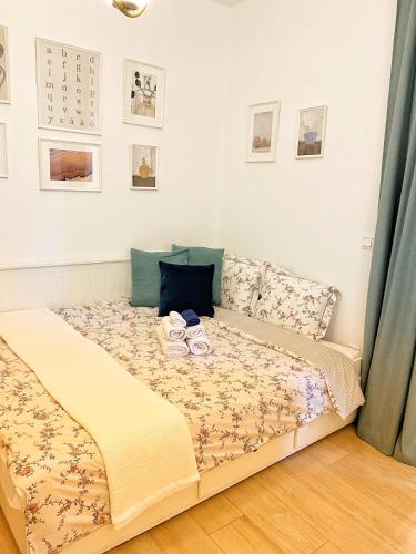 a bedroom with a bed with two shoes on it at Διαμέρισμα στην Καλλιθέα in Athens