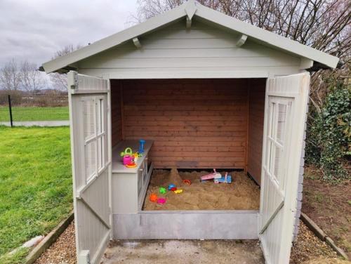 a white play house with a sandbox in it at Sluizen aan de Jeker in Tongeren