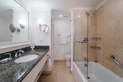 a bathroom with a sink and a shower and a toilet at Sea View - Glitter Bay in Saint James