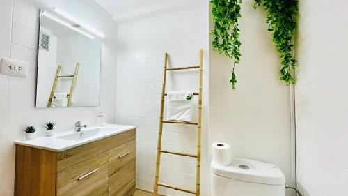 a bathroom with a sink and a toilet at Valencia Private Rooms in Shared Apartment in Valencia