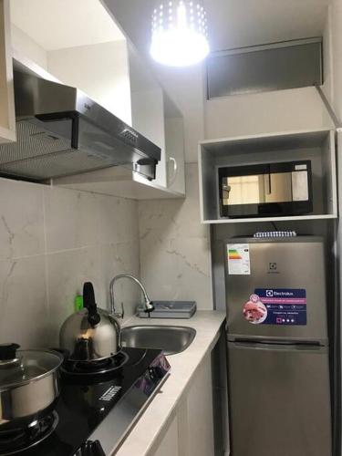 Η κουζίνα ή μικρή κουζίνα στο Albano habitación acústica cocina y baño
