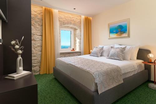 Villa Kiki tesisinde bir odada yatak veya yataklar