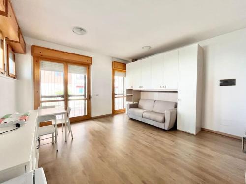 a living room with a couch and a table at Brunori Home in Rome