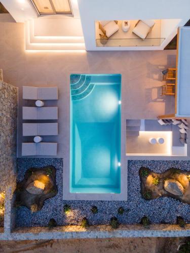 an overhead view of a swimming pool in a house at Fyrōi Naxos in Agia Anna Naxos
