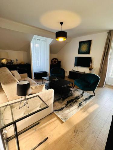 Posezení v ubytování Appartement Élégant, Climatisation et Piscine