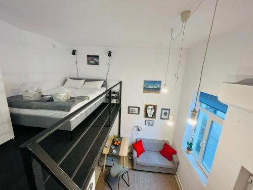 a bedroom with a bed and a glass railing at Eroilor Art Studio in Cluj-Napoca