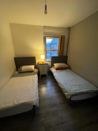 Ένα ή περισσότερα κρεβάτια σε δωμάτιο στο Lovely 2 bedroom holiday home with free parking