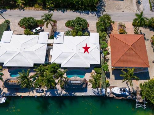 an aerial view of a building with a red star on it at Marathon Vacation Bliss Waterfront Pool and Cabana in Marathon