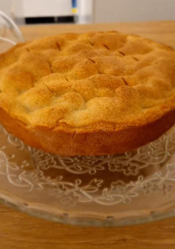 a pie sitting on a glass plate on a table at Affittacamere San Teodoro in Albenga
