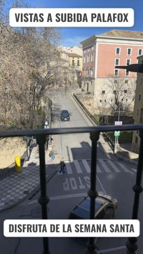 a view of a city street from a balcony at cuencaloft trinidad in Cuenca