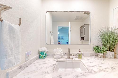 a bathroom with a sink and a mirror at Lola's Casa Azul #4313 in Palm Springs