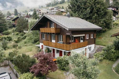 an aerial view of a house with a balcony at Apartment im Chalet Speer in Amden