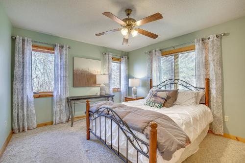 a bedroom with a bed and a ceiling fan at Spacious Stoddard Retreat on Mississippi River! 