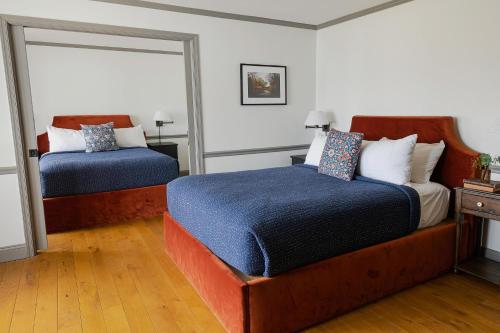 Ein Bett oder Betten in einem Zimmer der Unterkunft Wylder Windham