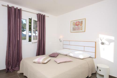 Ένα ή περισσότερα κρεβάτια σε δωμάτιο στο Residence Catherine