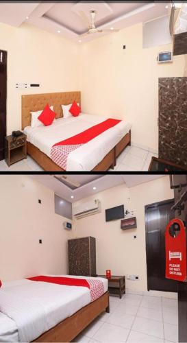 1 Schlafzimmer mit 2 Betten mit roter und weißer Bettwäsche in der Unterkunft Hotel moon place in Lucknow