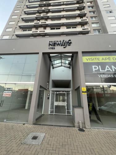 a large building with a gate in front of it at Apartamento/Studio Novo Hamburgo in Novo Hamburgo