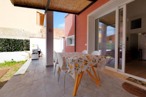 a dining room with a table and chairs at Newly built Holiday House in Teulada in Teulada