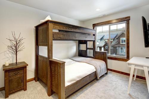 a bedroom with a bunk bed and a window at Great Location Near Pool with Suncadia Pool Access in Cle Elum