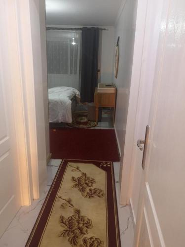 a room with a door with a mirror and a bedroom at My house 1 in Nador