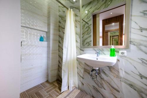 a bathroom with a sink and a mirror at Comfortable Villa in Quiet Area in Nusa Dua