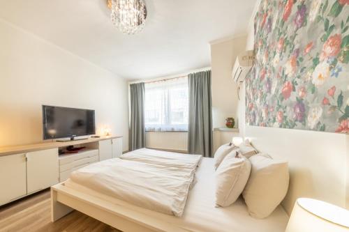 Postel nebo postele na pokoji v ubytování Valentina Apartment in CityCenter