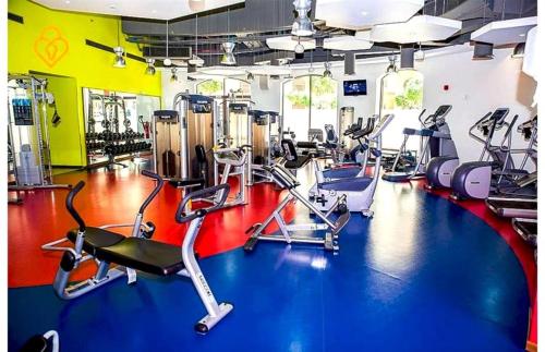 a gym with several cardio bikes and tread machines at ROYAL BEACH RESIDENCES 2 in Dubai