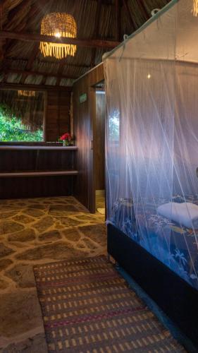 a room with a large aquarium in a building at Kite Eco House Salinas del rey in Salina de Rey
