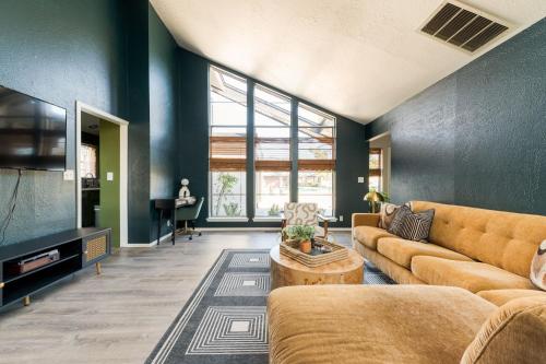 a living room with a couch and a table at Minutes To Ou Stadium Fire Pit Grill 3bd in Norman