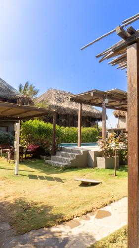 a resort with a yard with a pool at Kite Eco House Salinas del rey in Salina de Rey