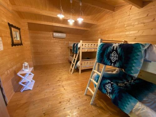 a room with a bunk bed in a cabin at Nagatoro Camp Village - Vacation STAY 06873v in Minano